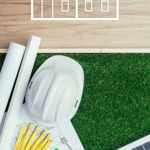 Kuvassa raksakypärä ja piirustuksia.